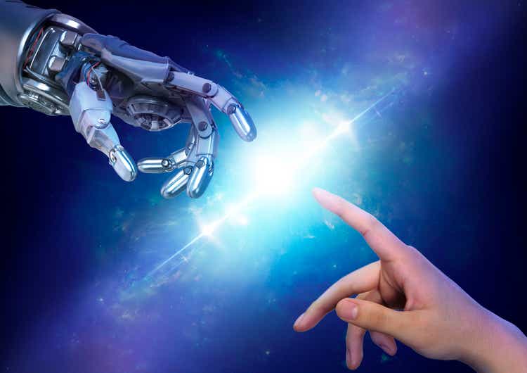 Robot hand close to touching a human hand