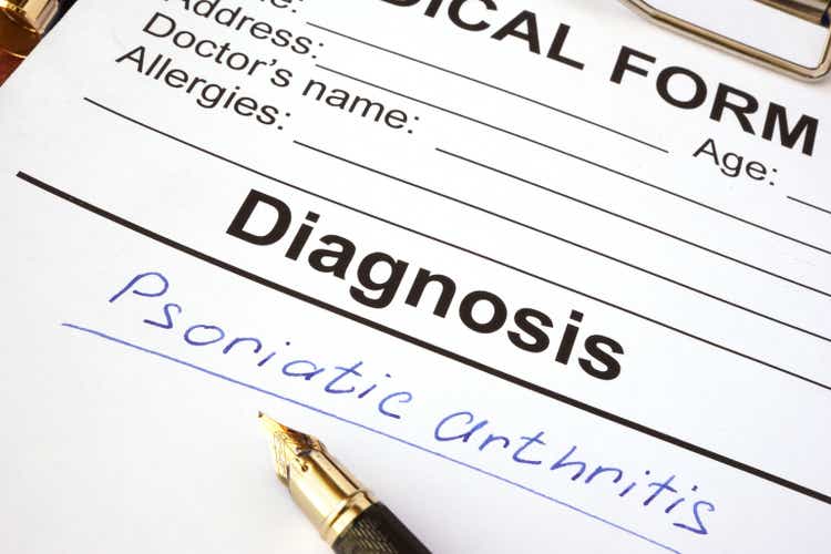 Medical form with diagnosis psoriatic arthritis on a table.