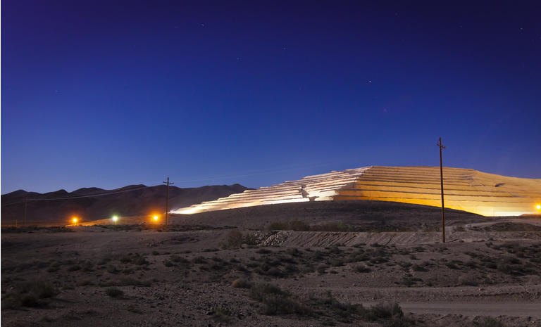 Modern strip mine in the Nevada desert at night.