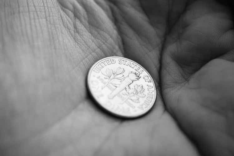 Coin on a palm of a hand
