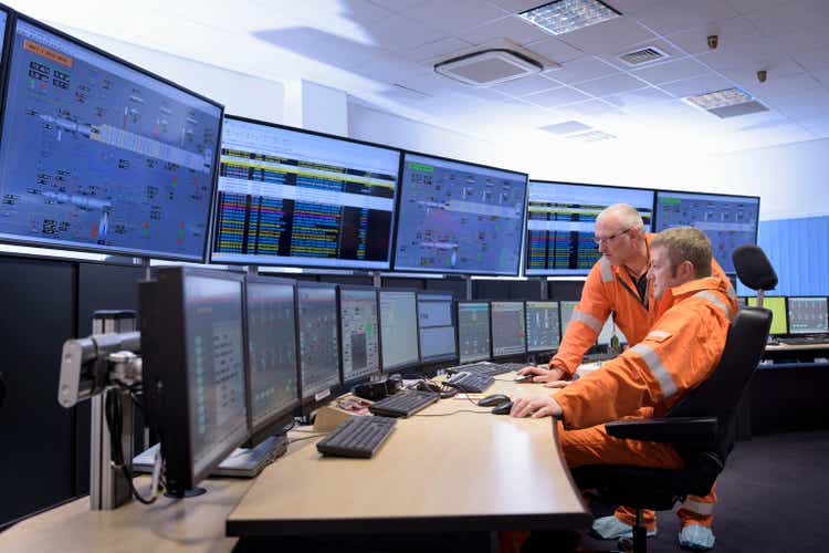 Workers in control room of gas-fired power station