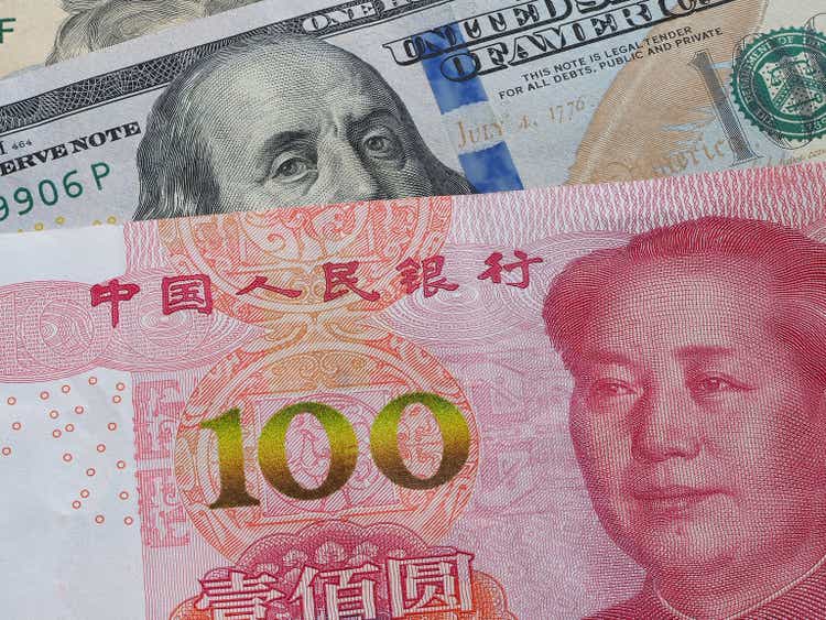 US dollar bill and China yuan banknote macro, Chinese and USA economy finance trade business, money closeup, forex concept.