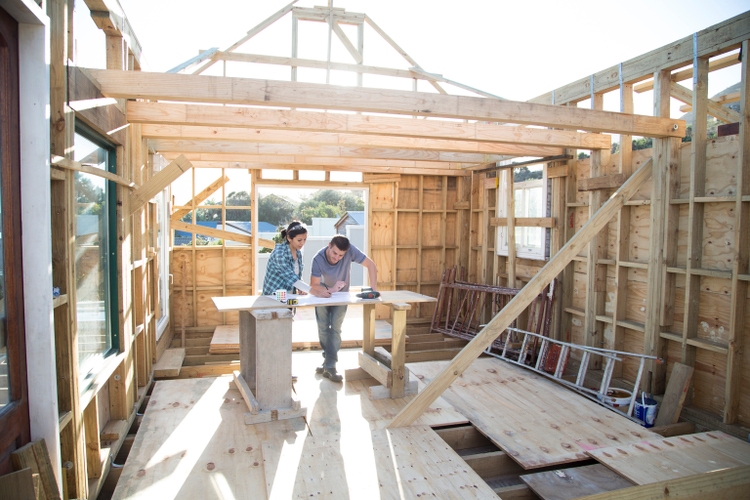 Couple working together on a new home