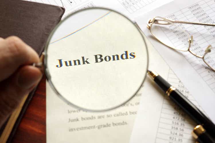 Document with title junk bond on a table. Selective focus.