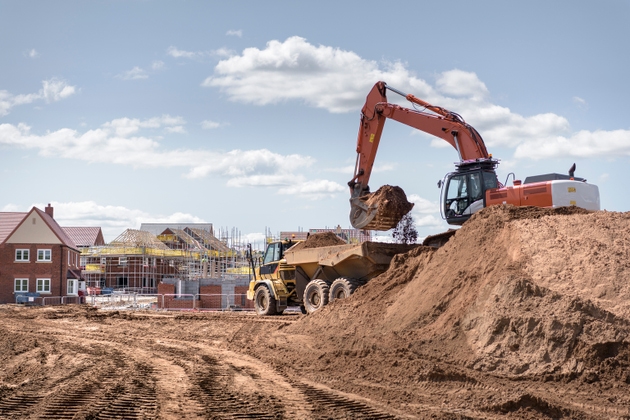 Housing starts jump more than expected in June, while building permits decline