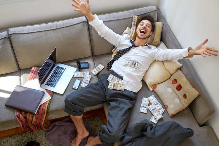 A man bursting with joy over a lot of money