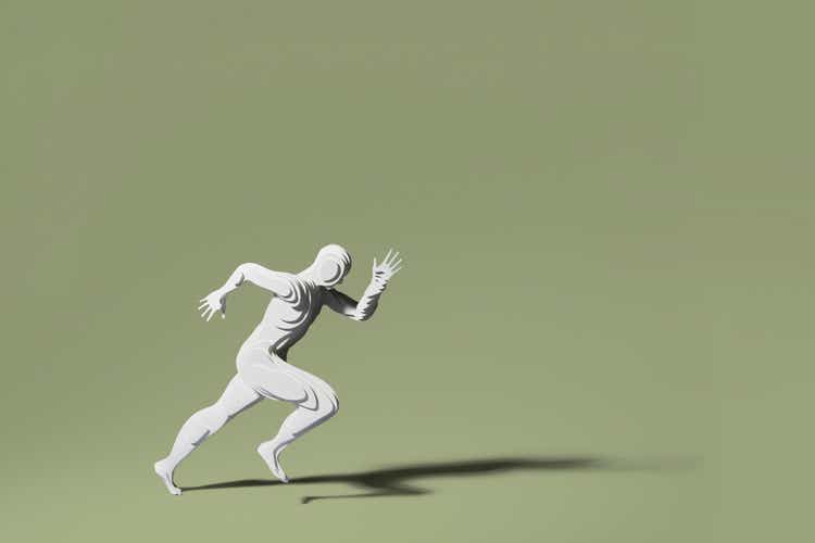 Hand cut paper figure of a runner