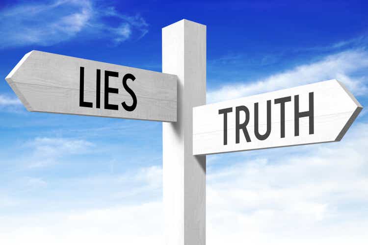 Lies, truth - wooden signpost