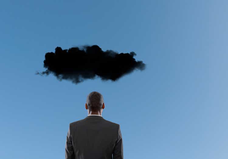 Dark cloud over Mixed Race businessman