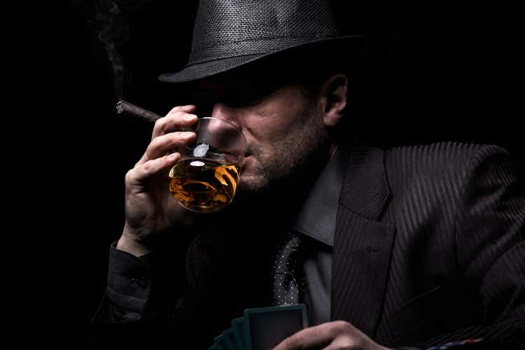 Male gambler playing poker.
