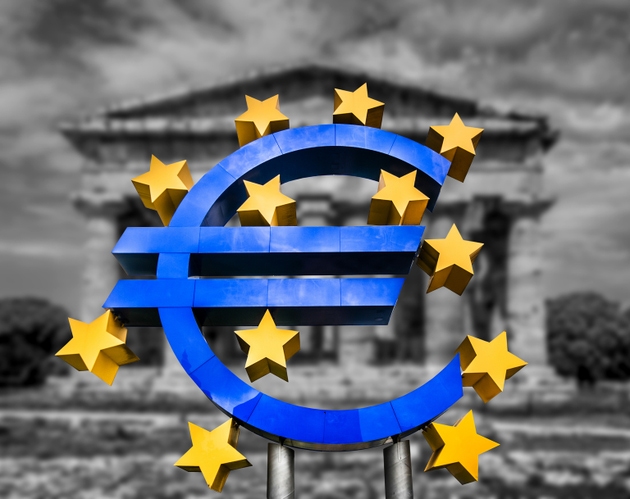 Euro sign on abstract blurred background of a Greek temple in black and white symbolizing a financial crisis