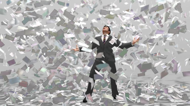 businessman under money fall