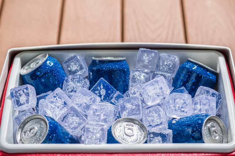 Cooler full of ice cold drinks cans