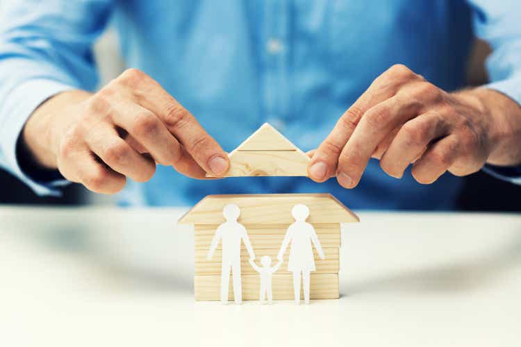 house mortgage concept - bank salesman help family to get new home
