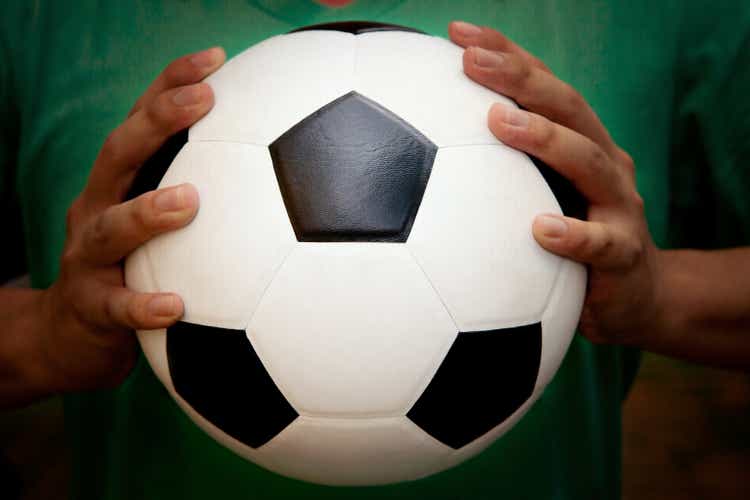 Apple Continues To Expand Into Area Few Initially Expected (NASDAQ:AAPL) - Seeking Alpha soceer football in man hand