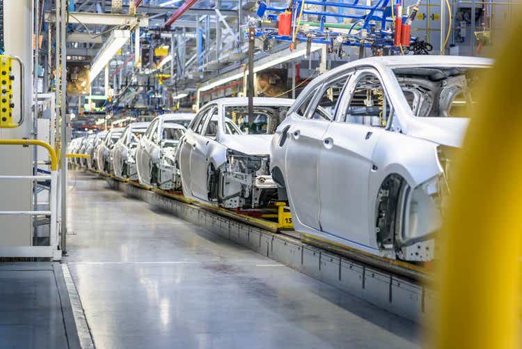 View of cars on production line in factory