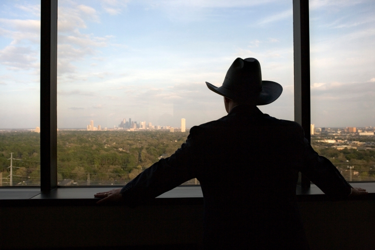 Cowboy executive at window