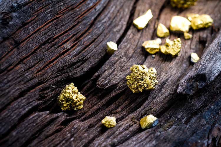 Pure gold ore on old wooden rails