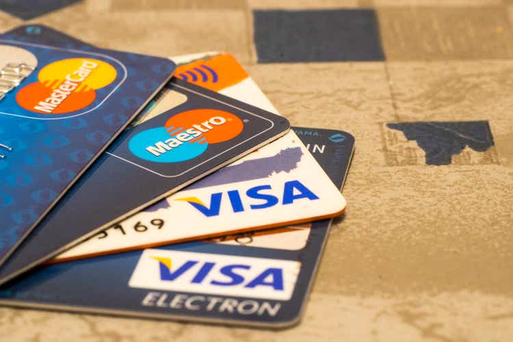 Sarajevo, Bosnia and Herzegovina - December 21, 2016: closeup pile of credit cards, Visa and MasterCard, credit, debit and electronic on ceramic surface background