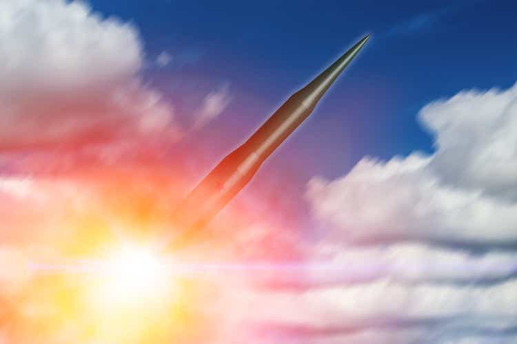 Intercontinental Ballistic Missile (ICBM) rocket lunched flying in the sky for nuclear bomb test illustration concept.