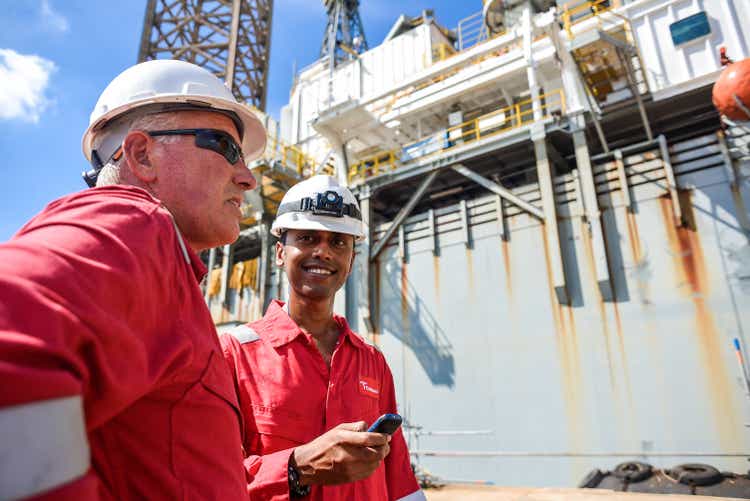 Man discussing in oil rig maintenance at shipyard