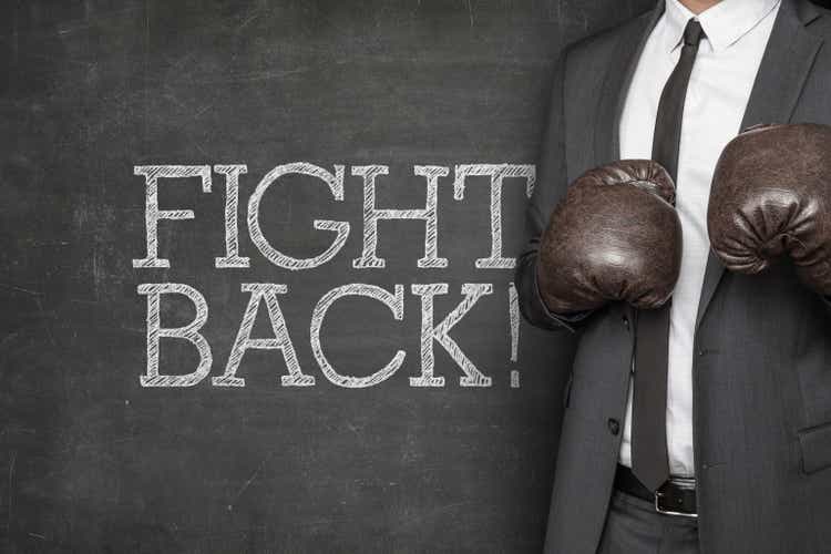 Fight back on blackboard with businessman