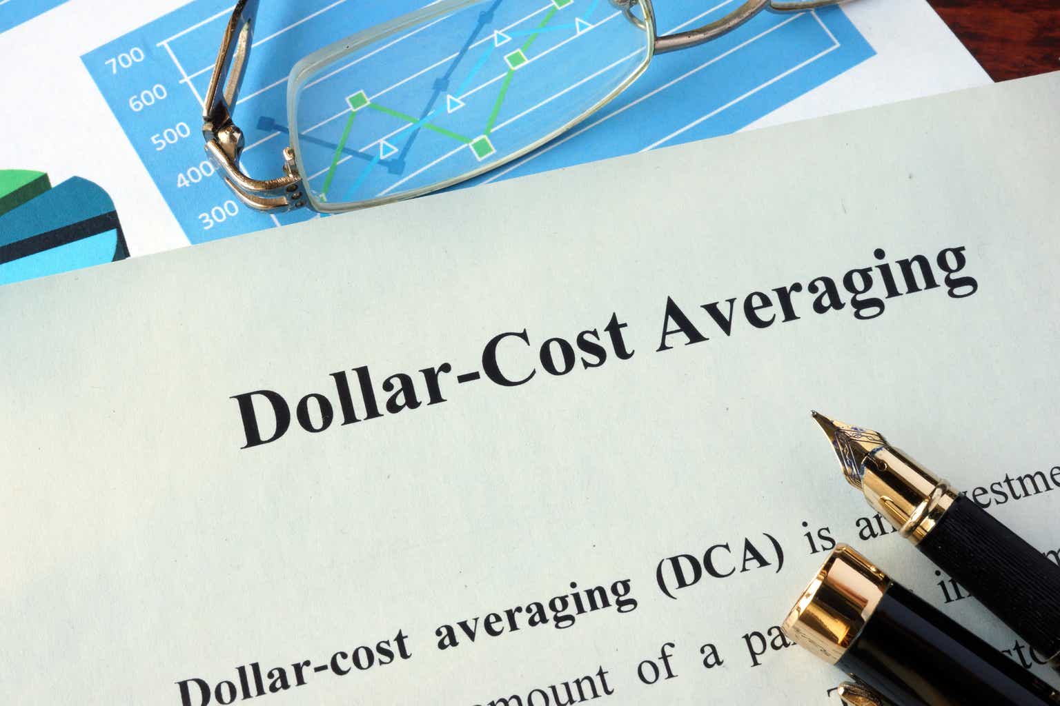 Dollar-cost averaging (DCA) on a paper and charts.
