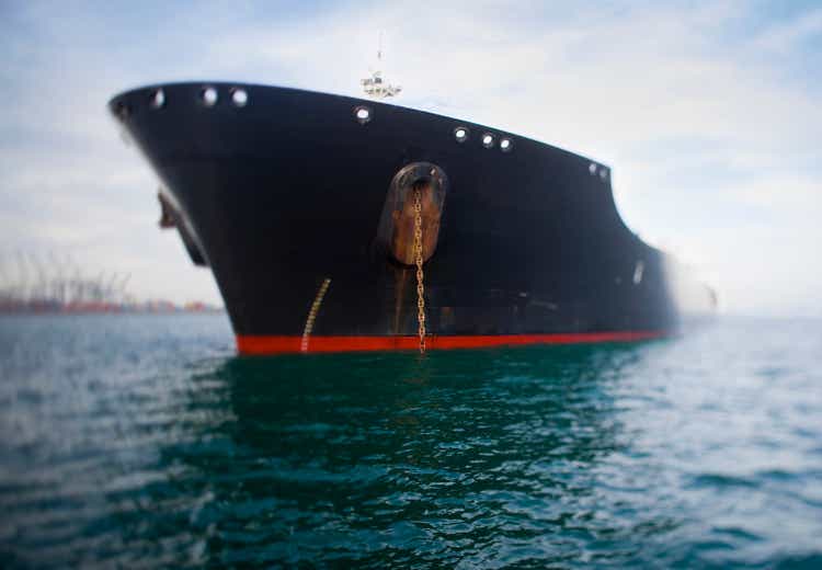 Bow view of navy blue oil tanker.