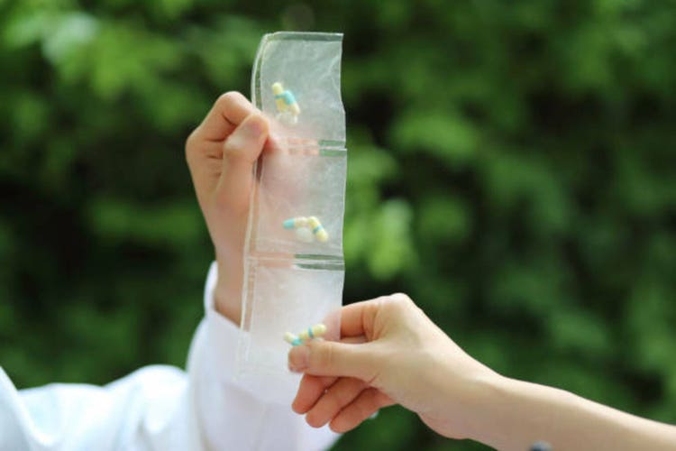 Hands holding prescription drugs