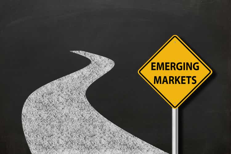 Emerging market ahead warning sign chalkboard way
