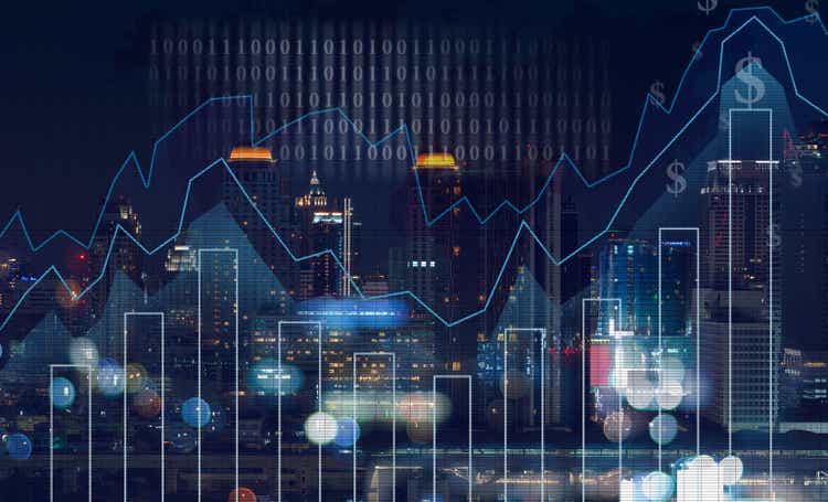 Trading graph against cityscape at night and world map background, business finance concept