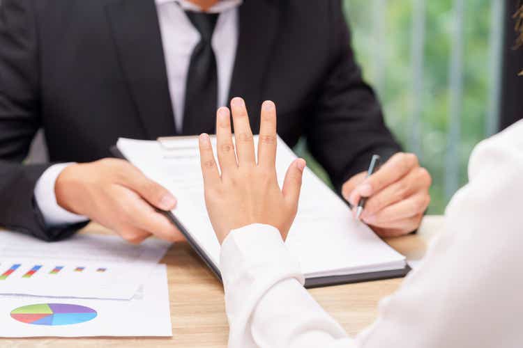 Customer or woman says no or hold on when businessman giving pen for signing a contract