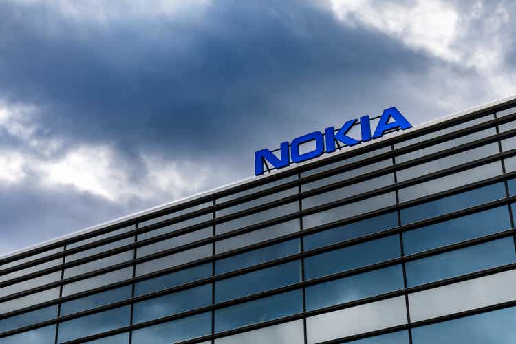 Dark clouds over Nokia logo on top of a building