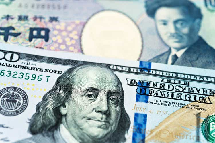 US dollars and Japanese currency background