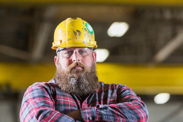 Bearded construction worker wearing hardhat