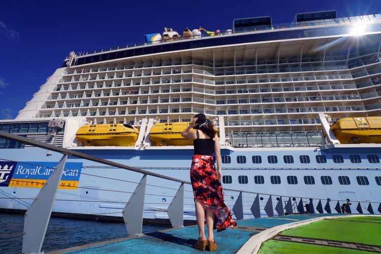 Woman Looking at a Cruise Ship