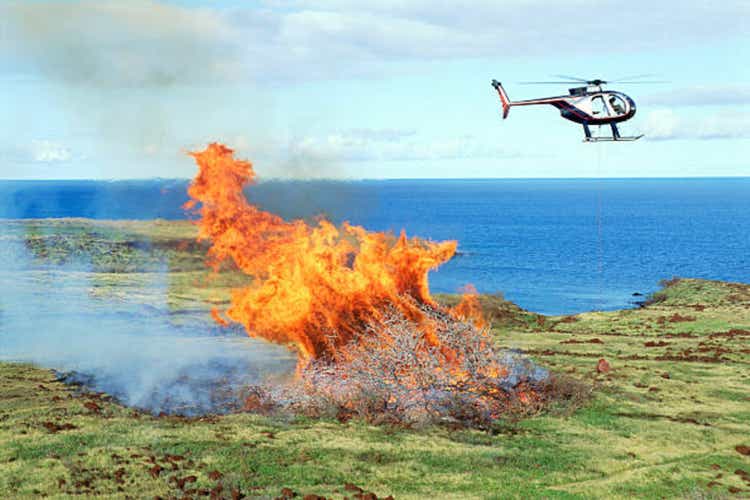 Helicopter over brush fire