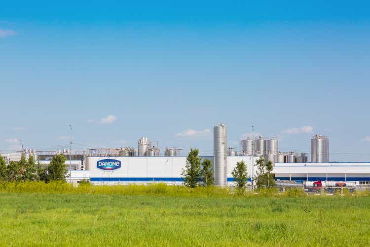 Danone factory in Russia with green grass and blue sky