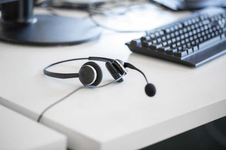 Headphones and computer keyboard on desk