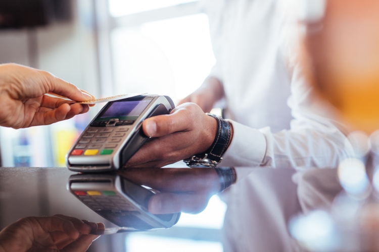 Customer using NFC technology for payment at bar