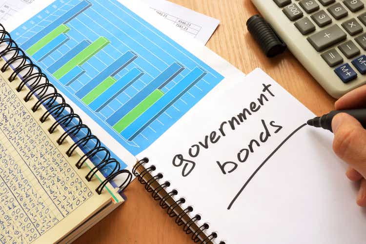 Government bonds written in a note. Trading concept.