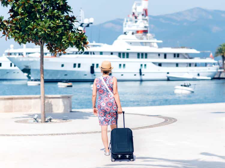 Woman with suitcase getting ready for her trip