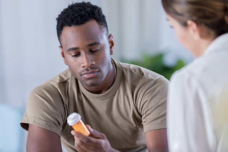 Young military officer receives medication for depression