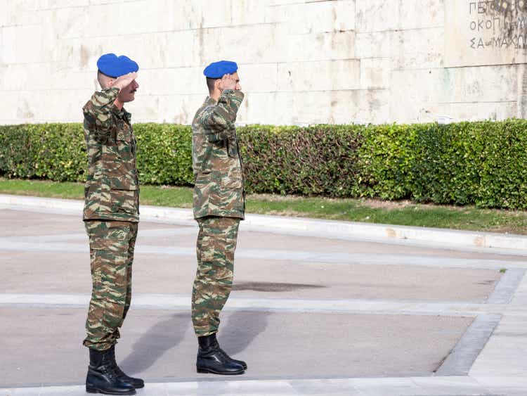 Greek solider saluting the Greek presidential guard, in front of the Greek parliament on Syntagma square. The Evzoni are one of the symbols of Greece