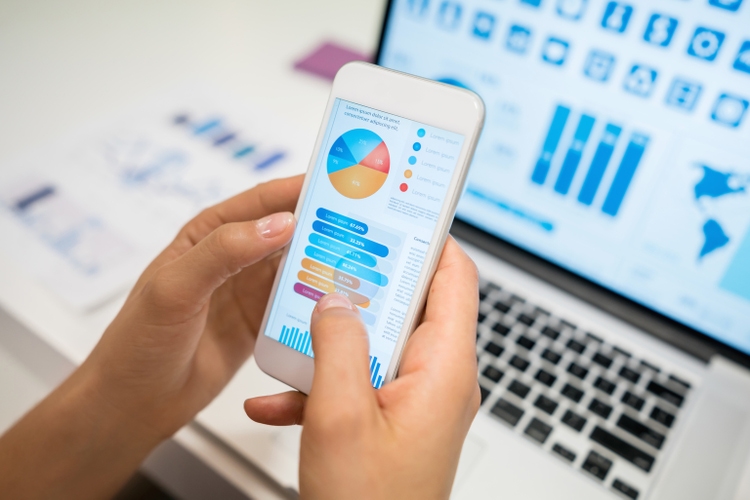 Unrecognizable woman using an app looking at statistics