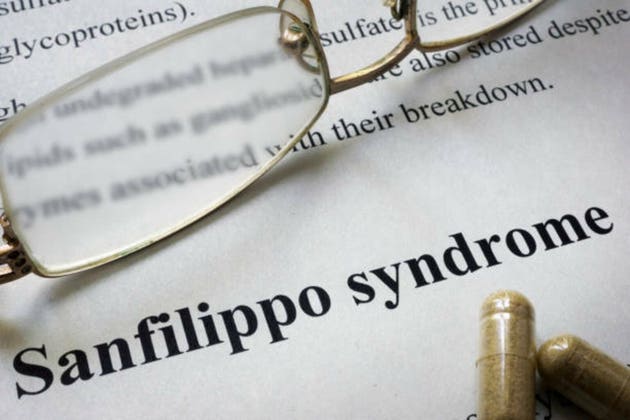 Paper with words Sanfilippo syndrome and glasses.