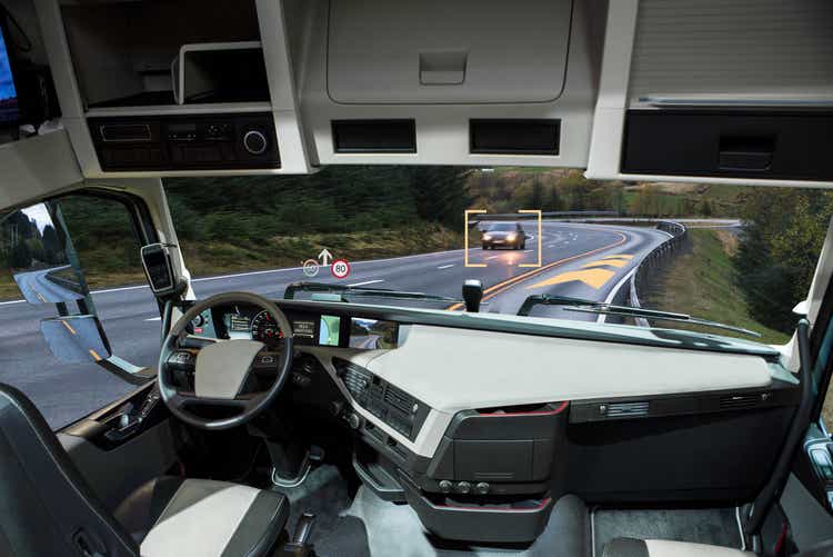 Self driving truck with head up display on a road.