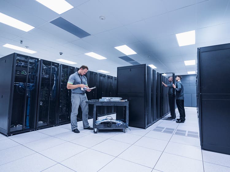 Men working in server room