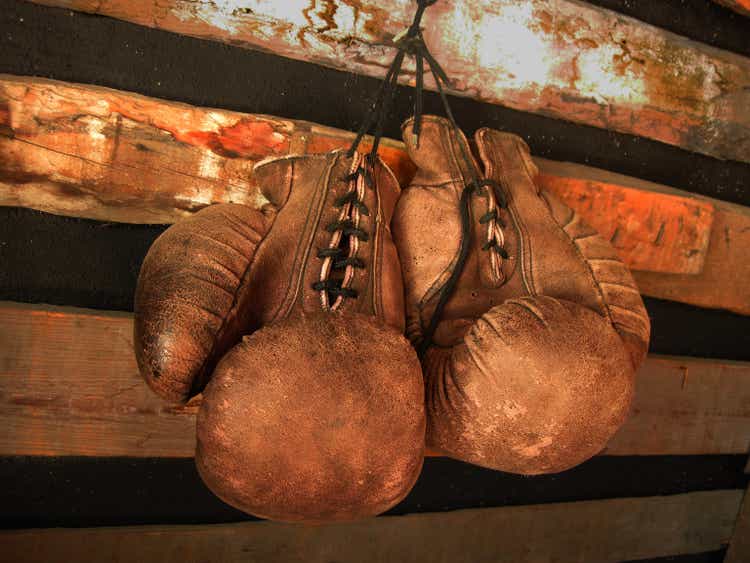 Boxing gloves on the wall. Old vintage leather gloves