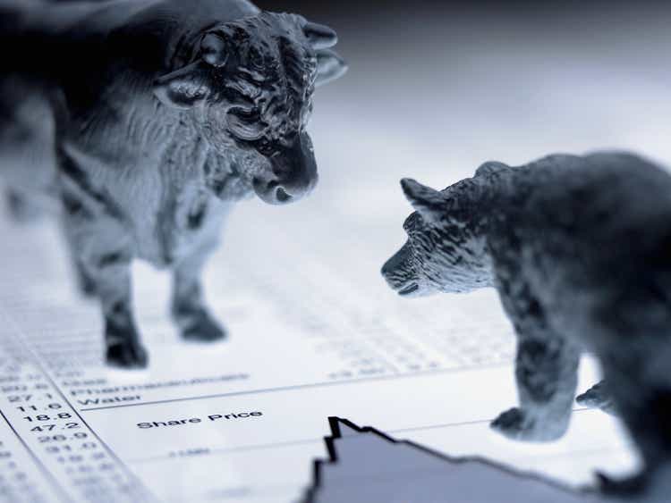 Bull and bear figurines on list of share prices
